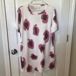 Cute pink-and brown cow print on a long T -shirt. Purchased at a Boutique.